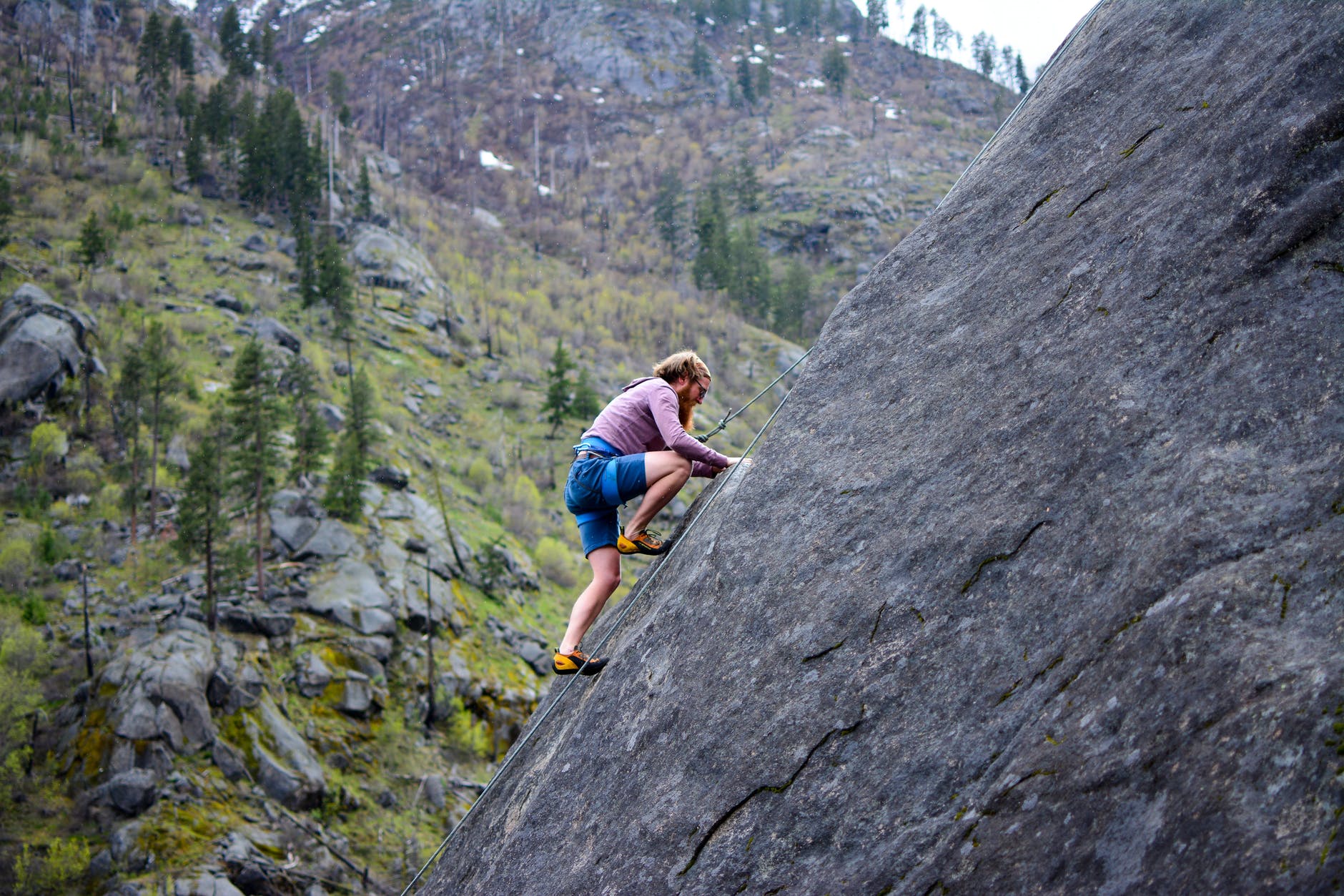 pexels photo 449609 man climbing on rock mountain
